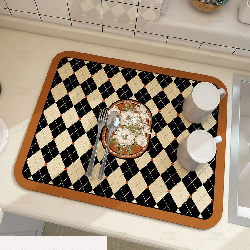 Black and cream argyle absorbent kitchen mat holding cups and cutlery