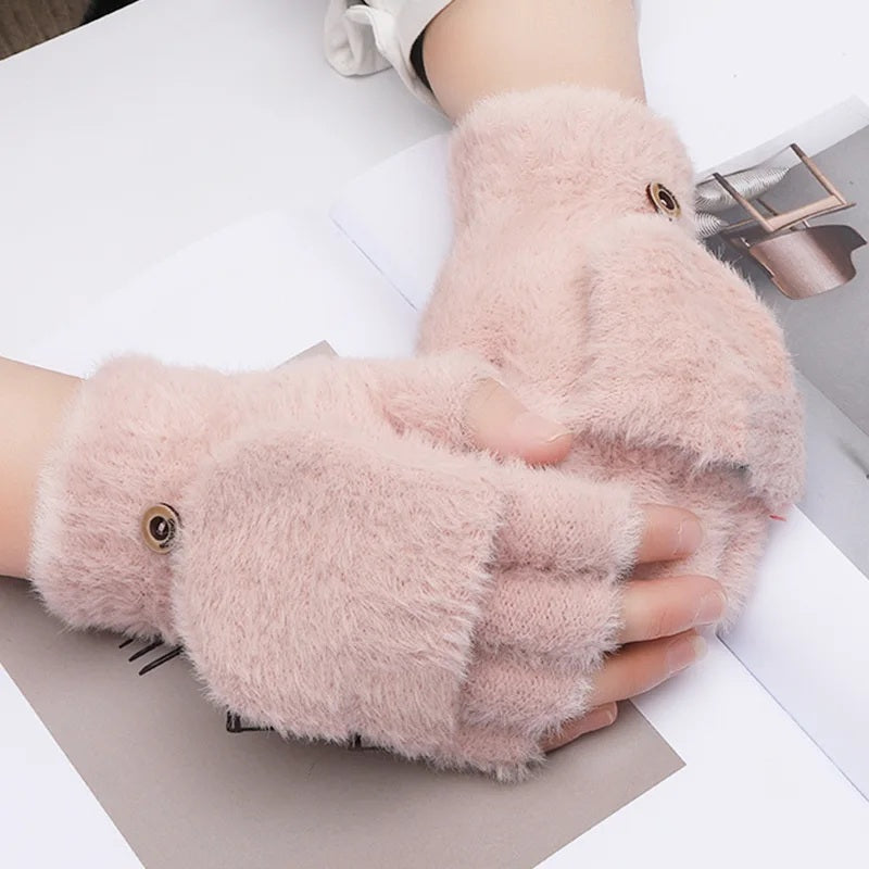Pink plush fingerless gloves worn on both hands