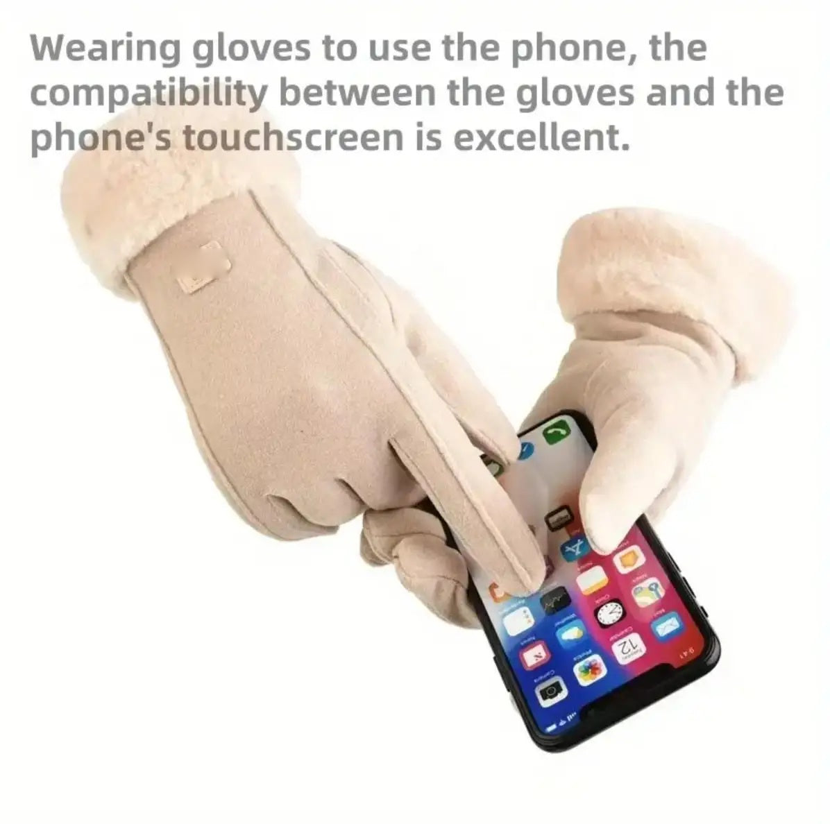 Gloved hands operating a phone touchscreen