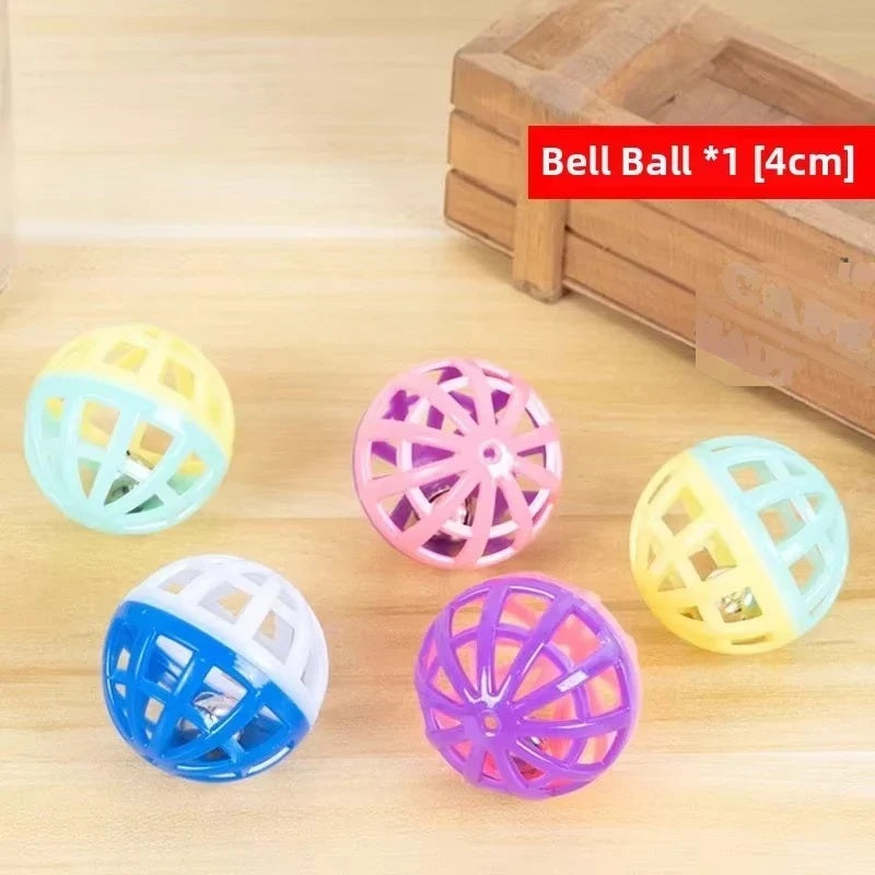 Cat puzzle toy balls arranged beside a wooden crate