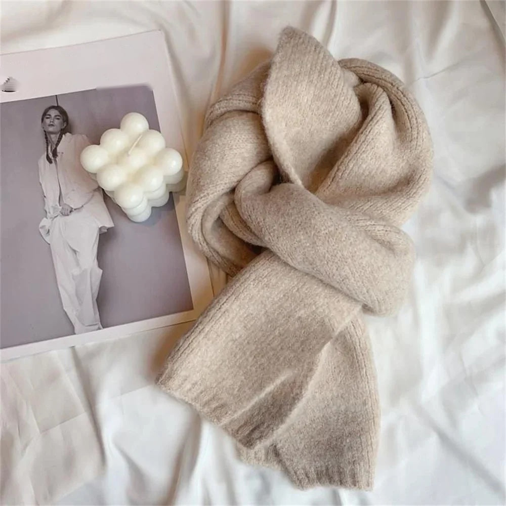 Cream cashmere scarf draped, flat lay with magazine