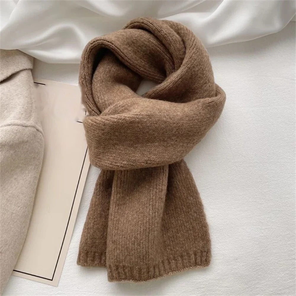 Camel cashmere scarf wrapped and knotted, flat lay