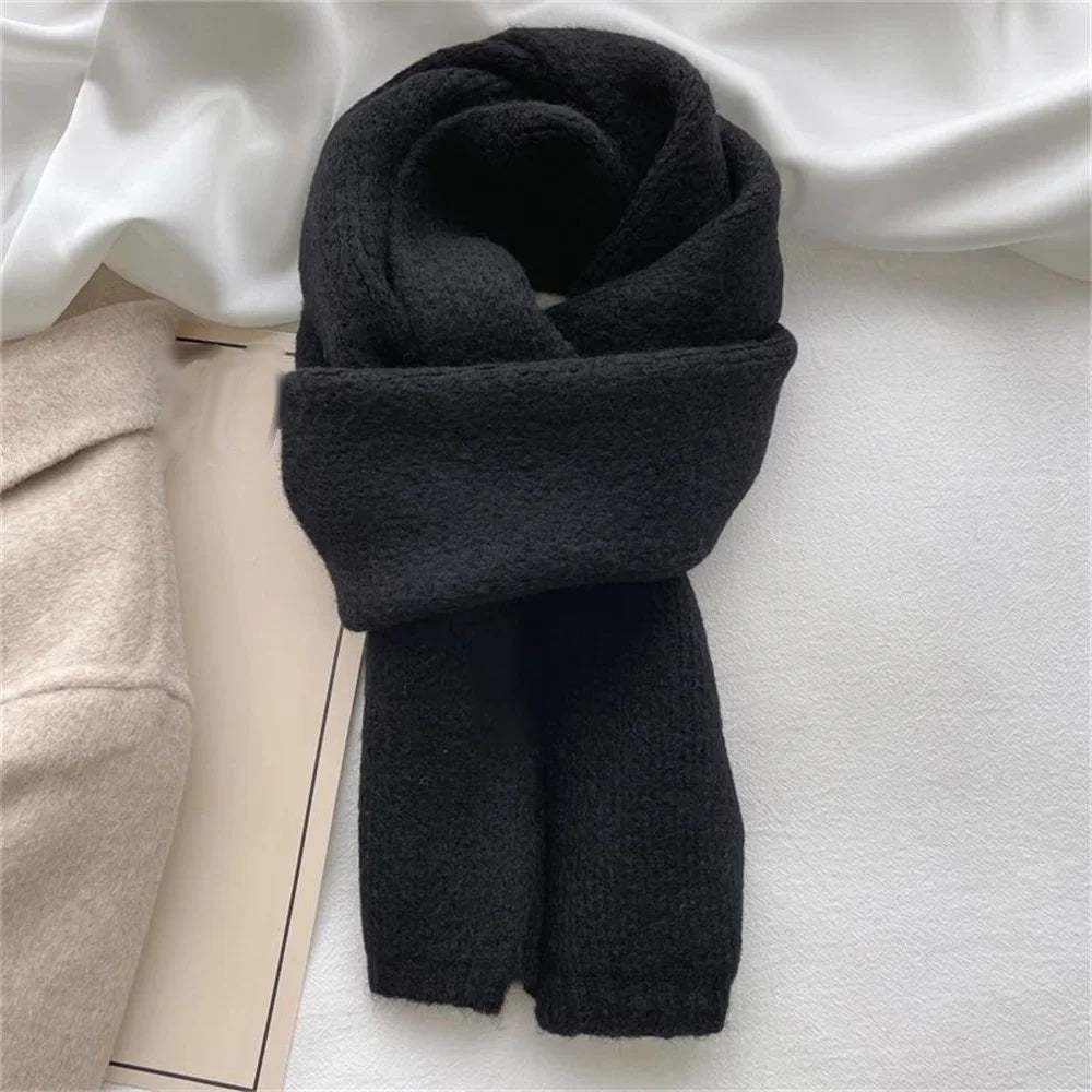 Charcoal cashmere scarf wrapped and knotted, flat lay