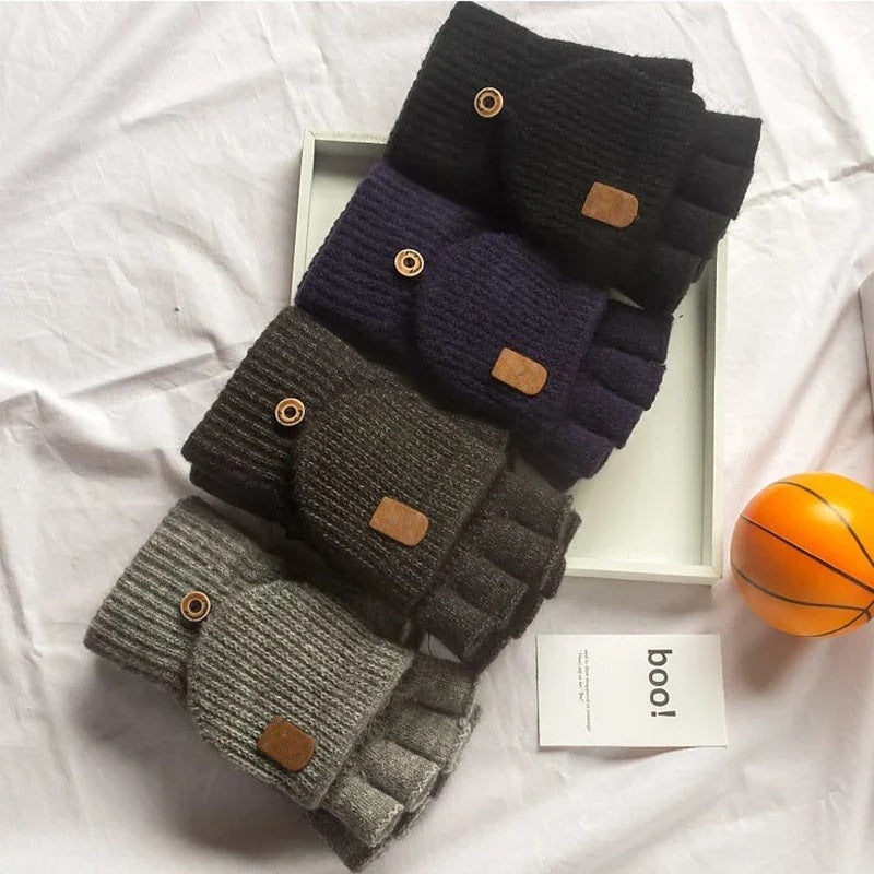 Four pairs of knitted fingerless gloves in black, navy, dark grey and light grey
