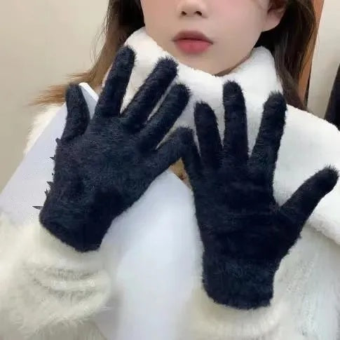 Model wearing navy plush velvet gloves with a white fur coat