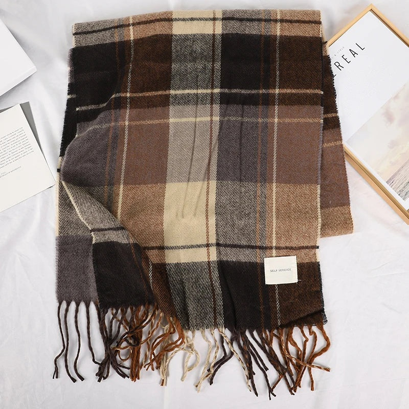 Brown plaid scarf laid flat with fringed ends