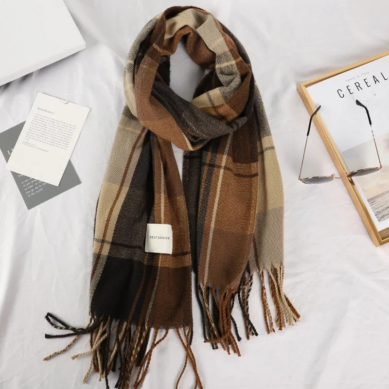 Plaid winter scarf styled in a loop on a white background