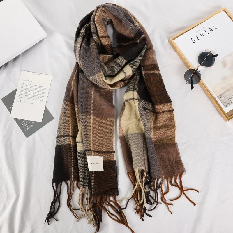 Plaid winter scarf with sunglasses and a magazine as props