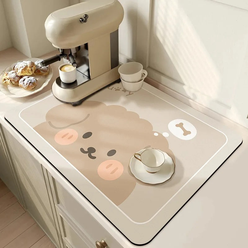 Cream espresso machine and pastries above a beige absorbent drying mat