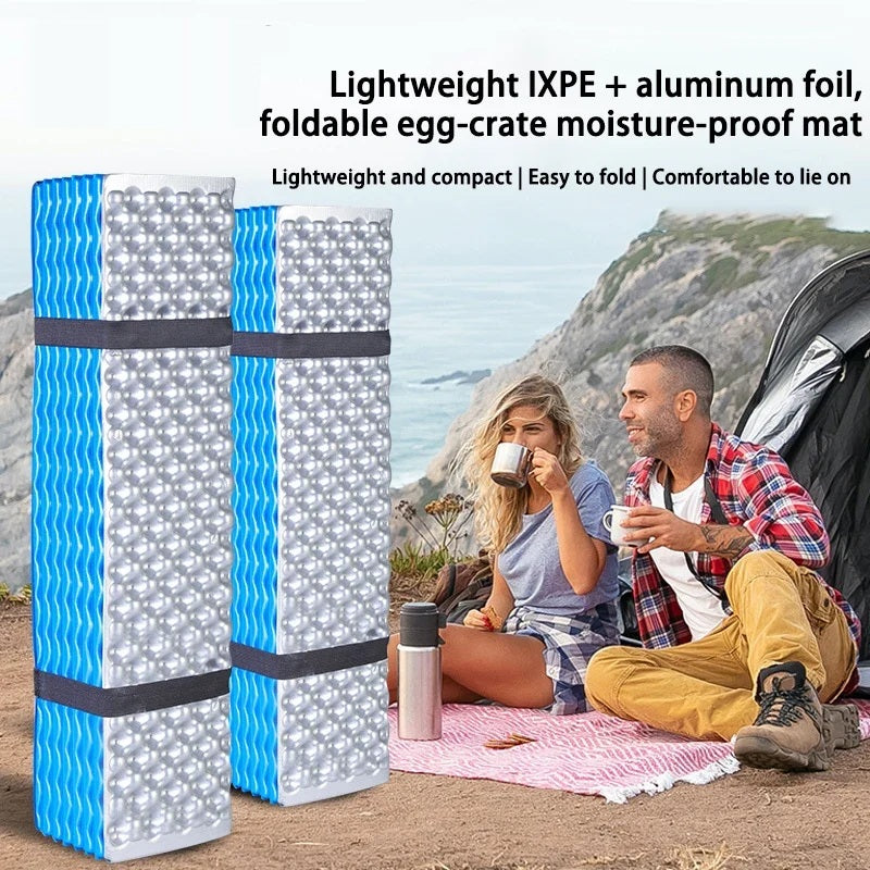Rolled egg crate foam sleeping pads with campers relaxing outdoors