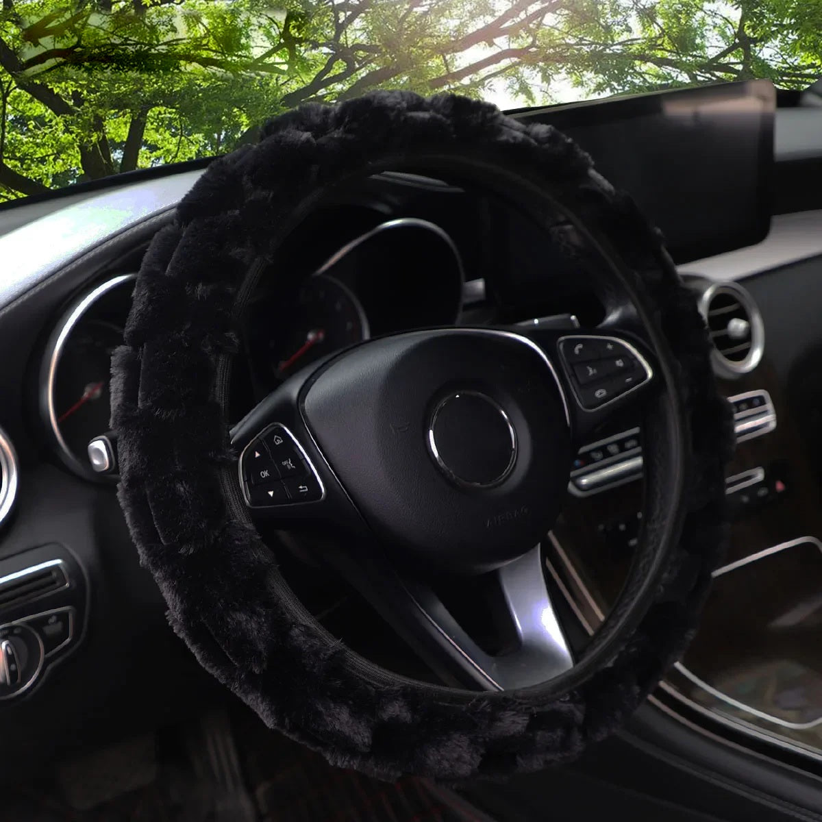 Black faux fur steering wheel cover fitted in a car