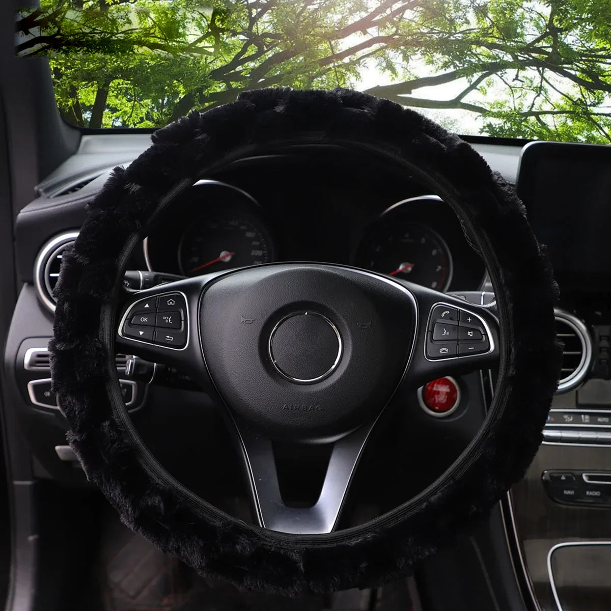 Black faux fur steering wheel cover, front view in car interior