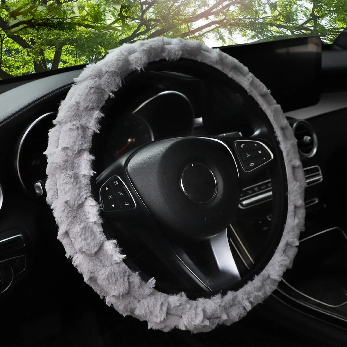 Grey faux fur steering wheel cover fitted in a car