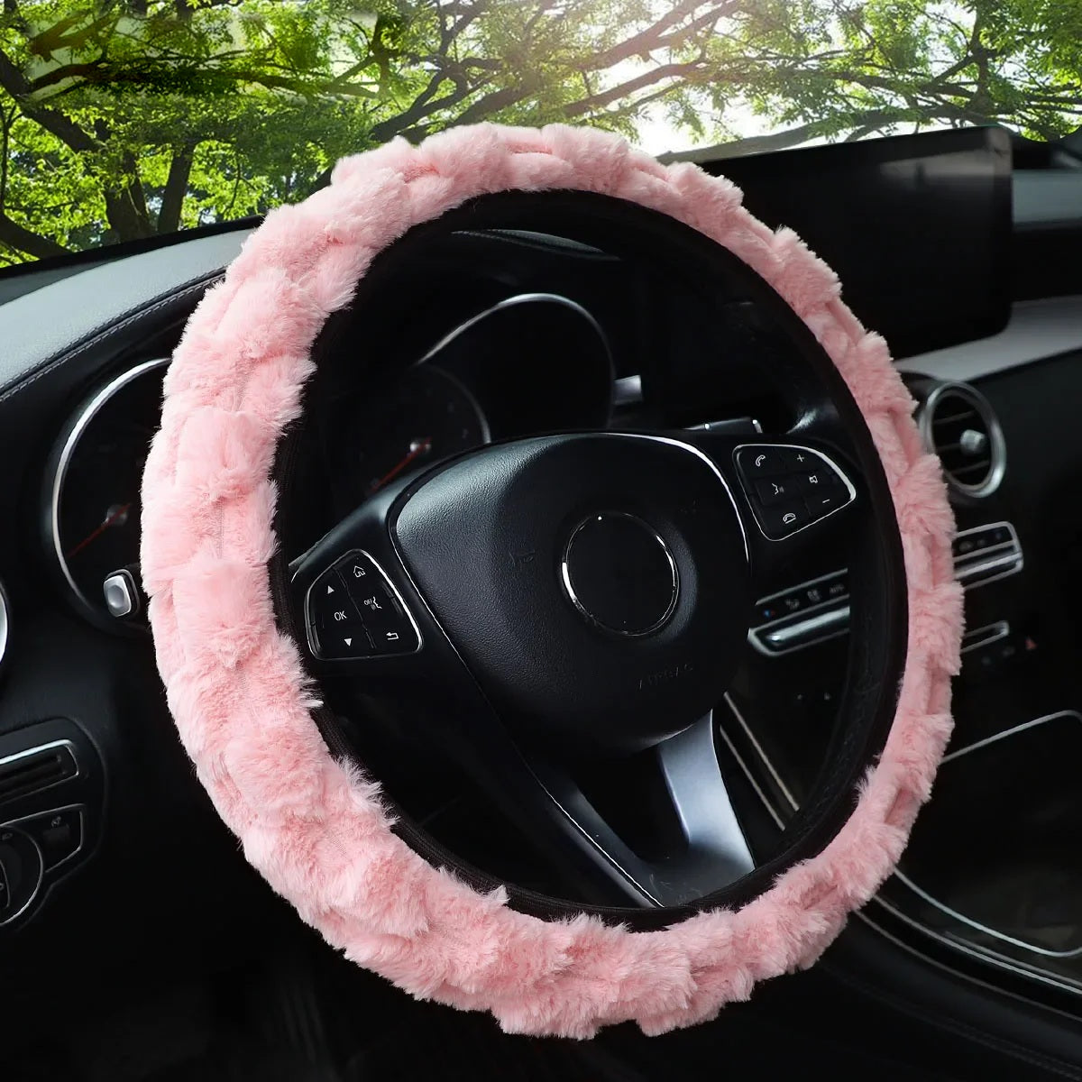 Pink faux fur steering wheel cover fitted in a car