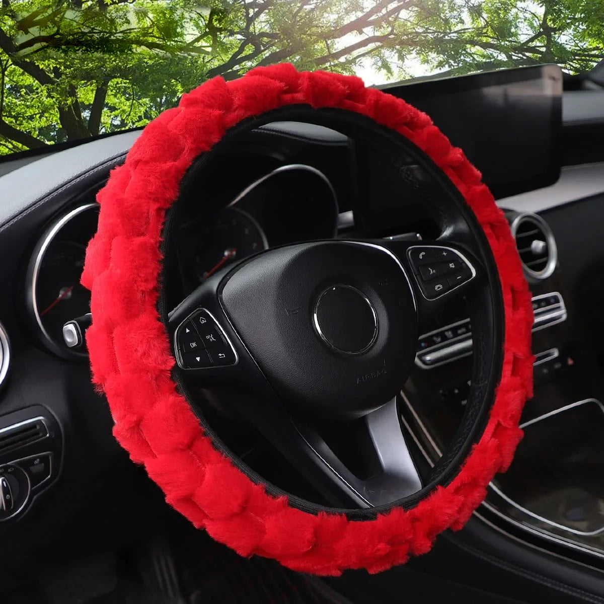 Red faux fur steering wheel cover fitted in a car