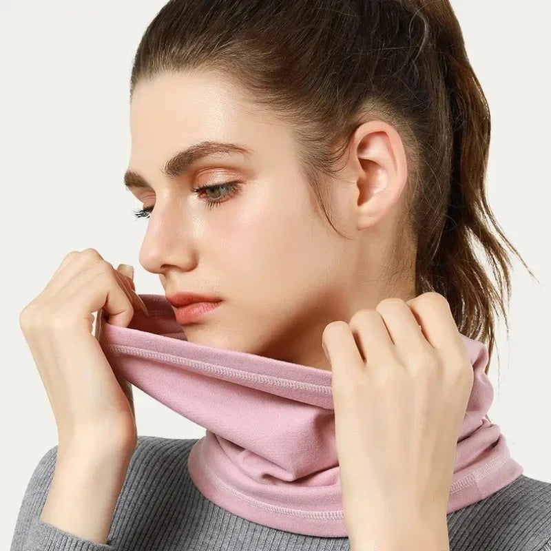 Woman wearing a pink thermal neck gaiter around her neck
