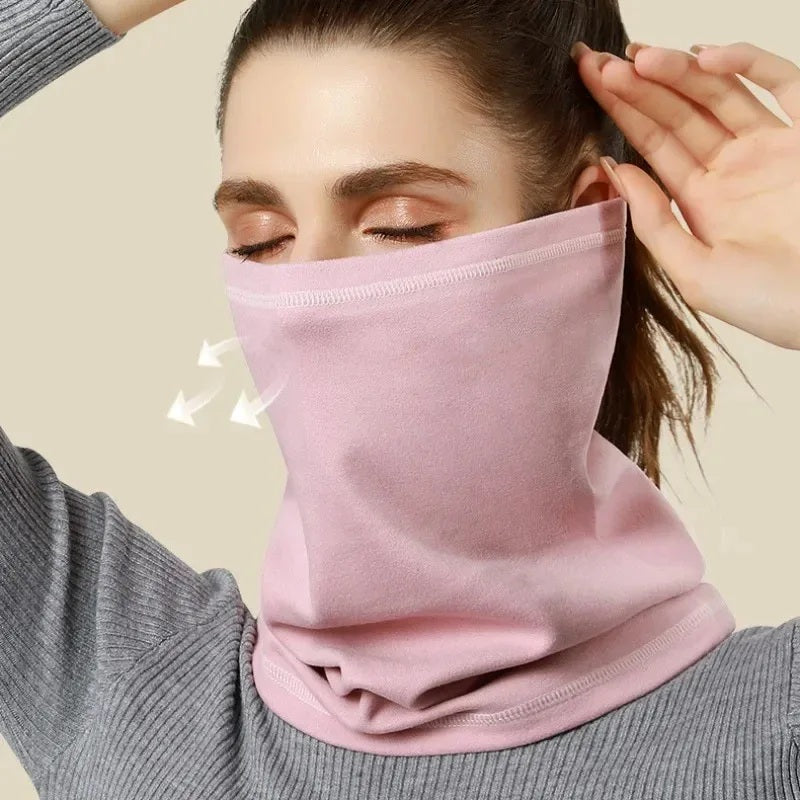 Close-up of a pink neck gaiter worn over the nose and mouth