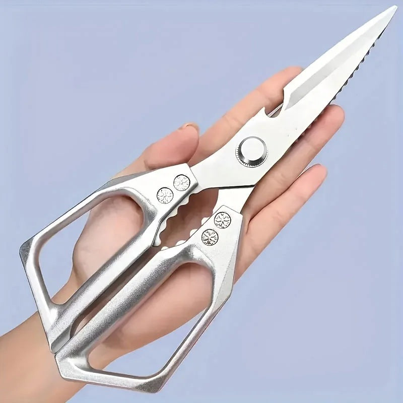 Hand holding the stainless steel kitchen scissors, blades open