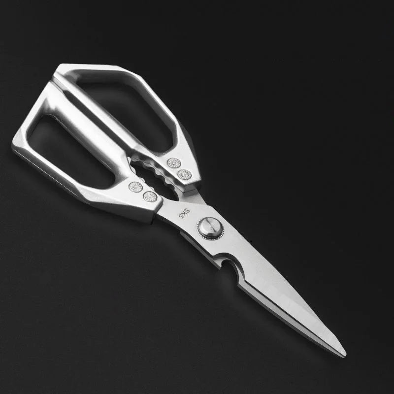 Close-up of the scissor pivot bolt and blade on a dark background