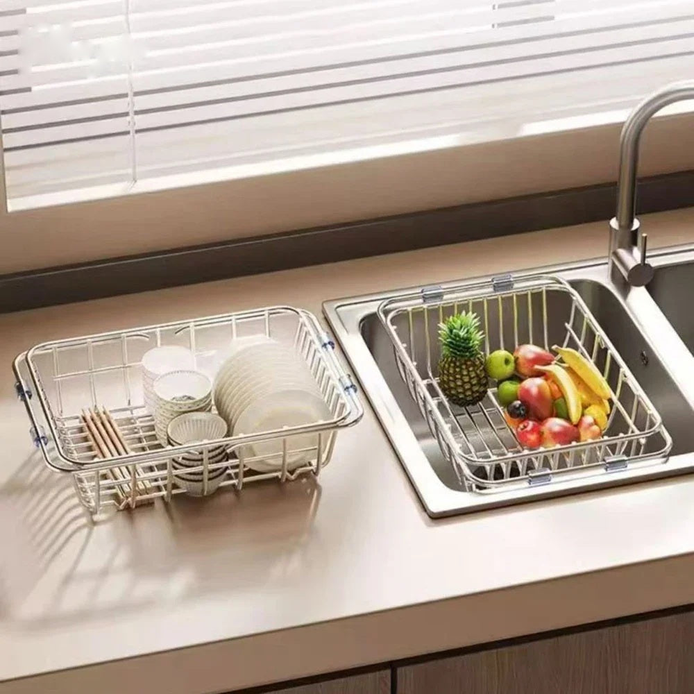 Over sink drying rack holding fruit beside a second rack on the worktop