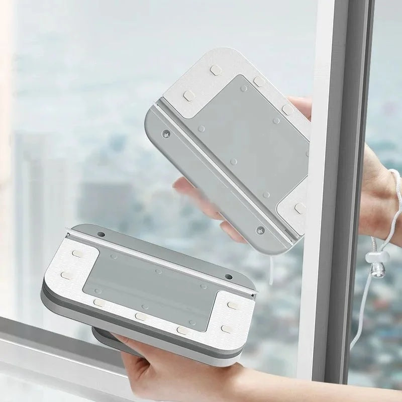 Magnetic window cleaner being placed on a bright window pane