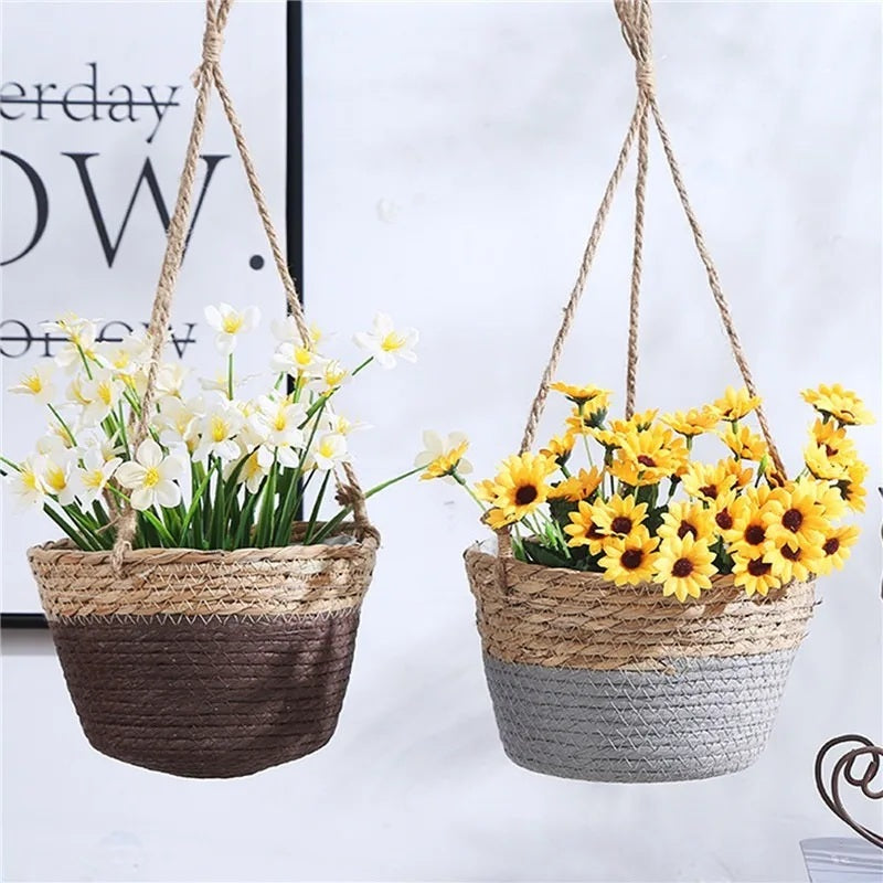 Two hanging jute planter baskets with flowers