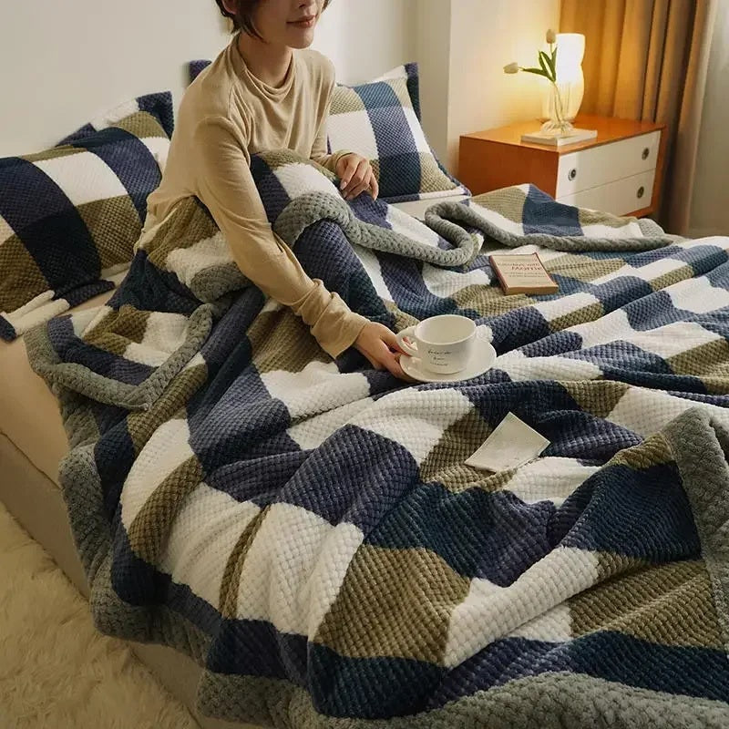 Chenille knit throw blanket spread across a bed