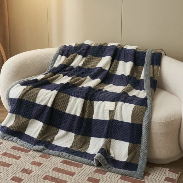 Chenille knit throw blanket draped over an armchair