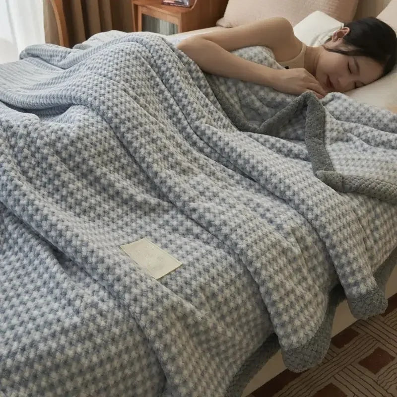 Chenille knit throw blanket used as a bed cover while sleeping