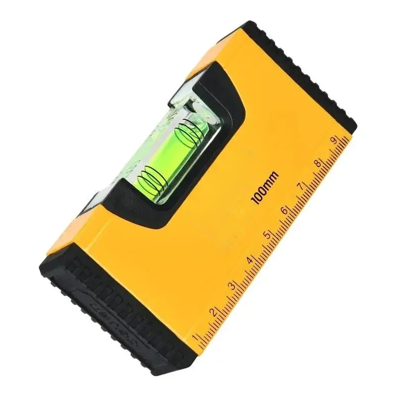 Yellow magnetic pocket spirit level with green bubble vial, angled studio view