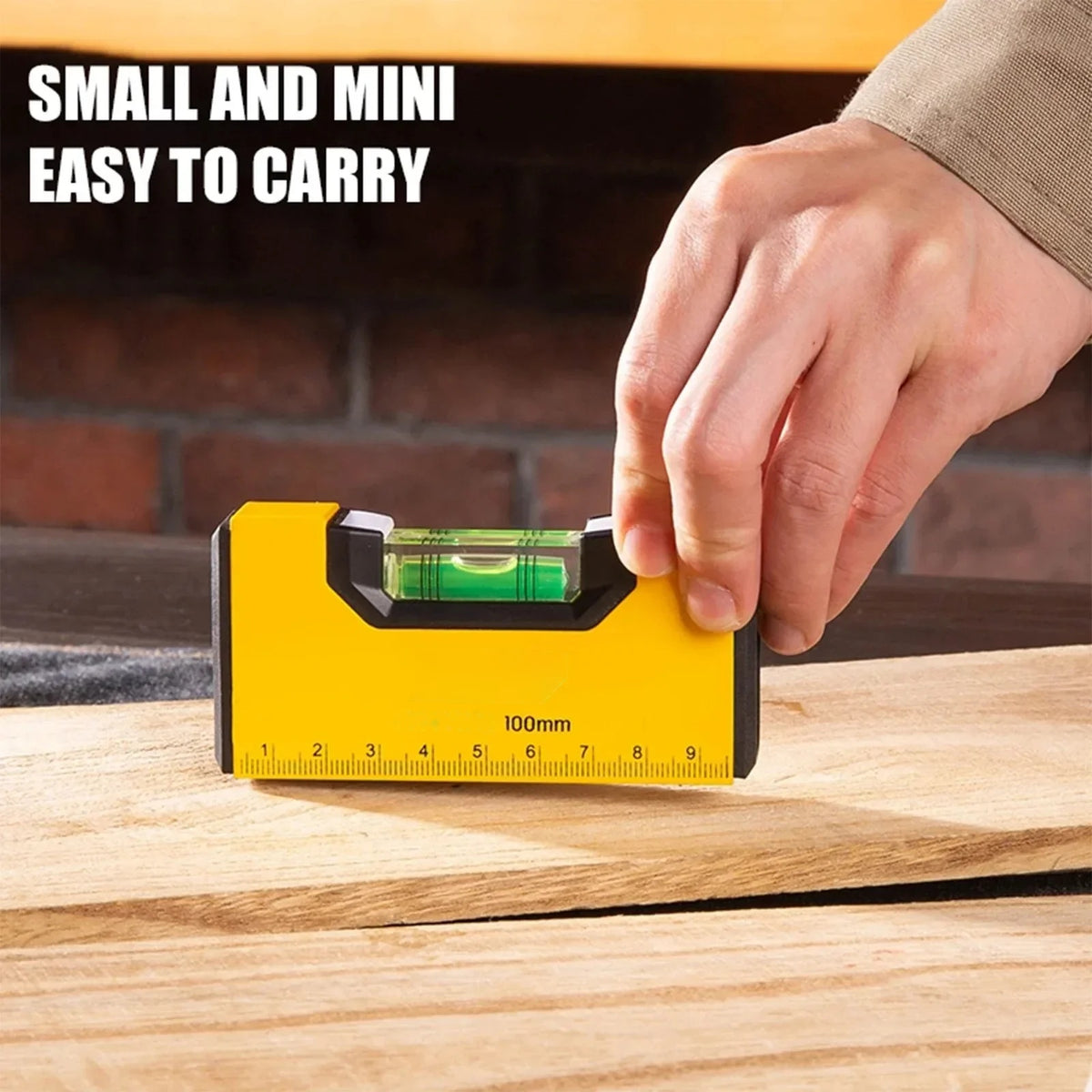 Pocket spirit level being used on a timber batten, small and easy to carry