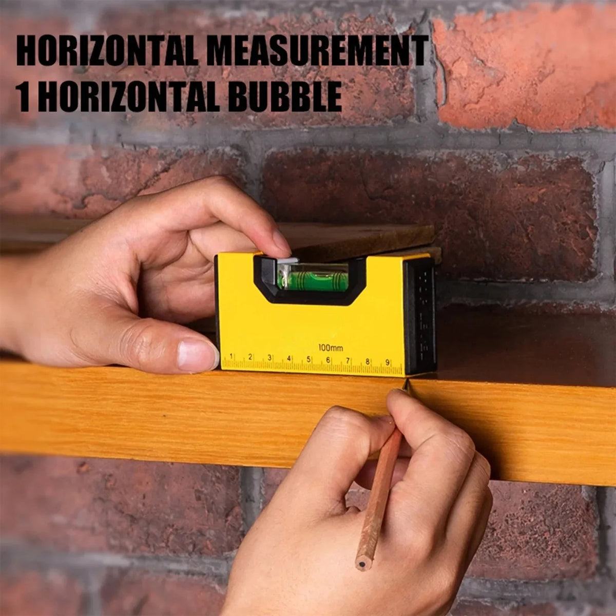 Spirit level used for horizontal measurement against a brick wall
