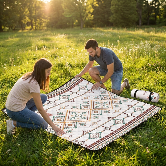 Couple relaxing on the large waterproof picnic blanket in a sunny park