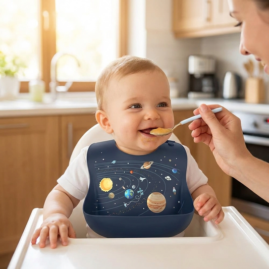 Baby wearing the waterproof silicone bib at mealtime